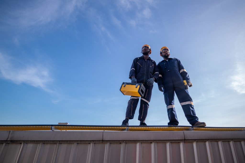 Construction workers standing on roof